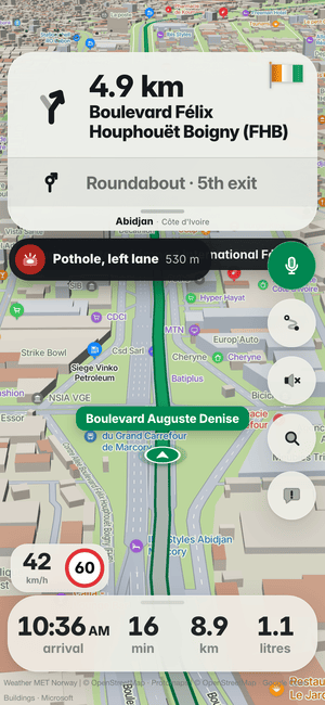 Driving in Abidjan: the “Pothole, left lane 530 m” banner, a pothole other drivers found ahead
