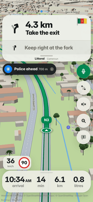 Driving in Douala: the “Police ahead 690 m” alert under the turn card, from other drivers’ reports