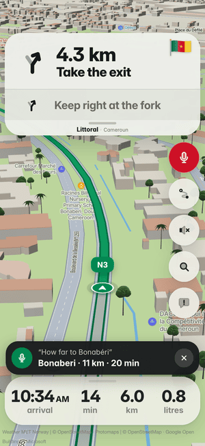 Driving in Douala, asking by voice “How far to Bonabéri”; the answer: Bonaberi · 11 km · 20 min