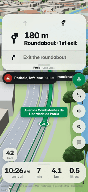 Driving in Praia: the “Pothole, left lane 540 m” banner, a pothole other drivers found ahead