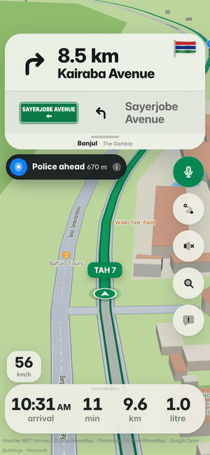 Driving in Banjul: the “Police ahead 670 m” alert under the turn card, from other drivers’ reports
