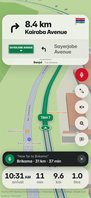 Driving in Banjul, asking by voice “How far to Brikama”; the answer: Brikama · 31 km · 37 min