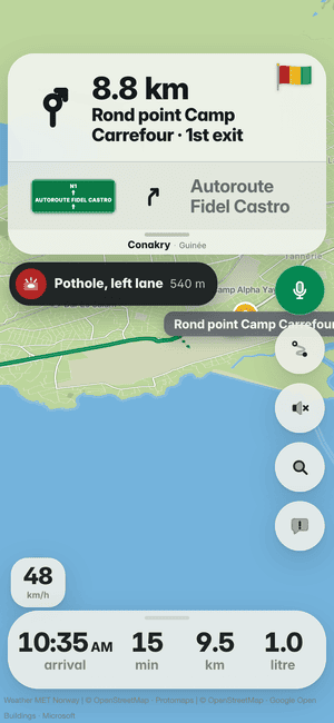 Driving in Conakry: the “Pothole, left lane 540 m” banner, a pothole other drivers found ahead