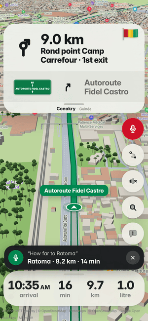 Driving in Conakry, asking by voice “How far to Ratoma”; the answer: Ratoma · 8.2 km · 14 min