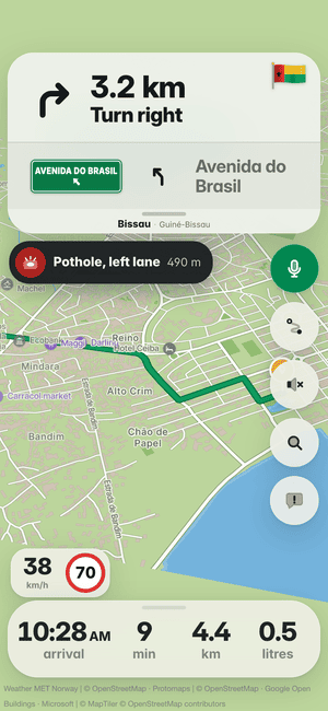 Driving in Bissau: the “Pothole, left lane 490 m” banner, a pothole other drivers found ahead