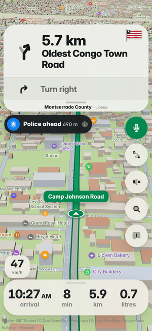 Driving in Monrovia: the “Police ahead 690 m” alert under the turn card, from other drivers’ reports