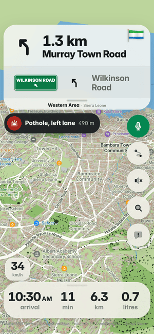 Driving in Freetown: the “Pothole, left lane 490 m” banner, a pothole other drivers found ahead