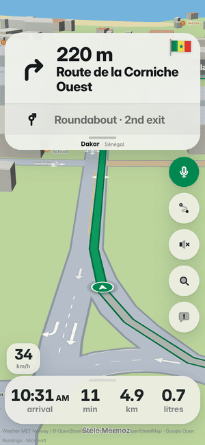 Driving in Dakar: in 220 m, turn right onto Route de la Corniche Ouest, then the roundabout’s 2nd exit; Senegal’s flag on the turn card