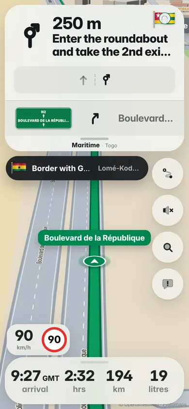 On the Boulevard de la République in Lomé: a Border with Ghana banner and the 90 km/h limit